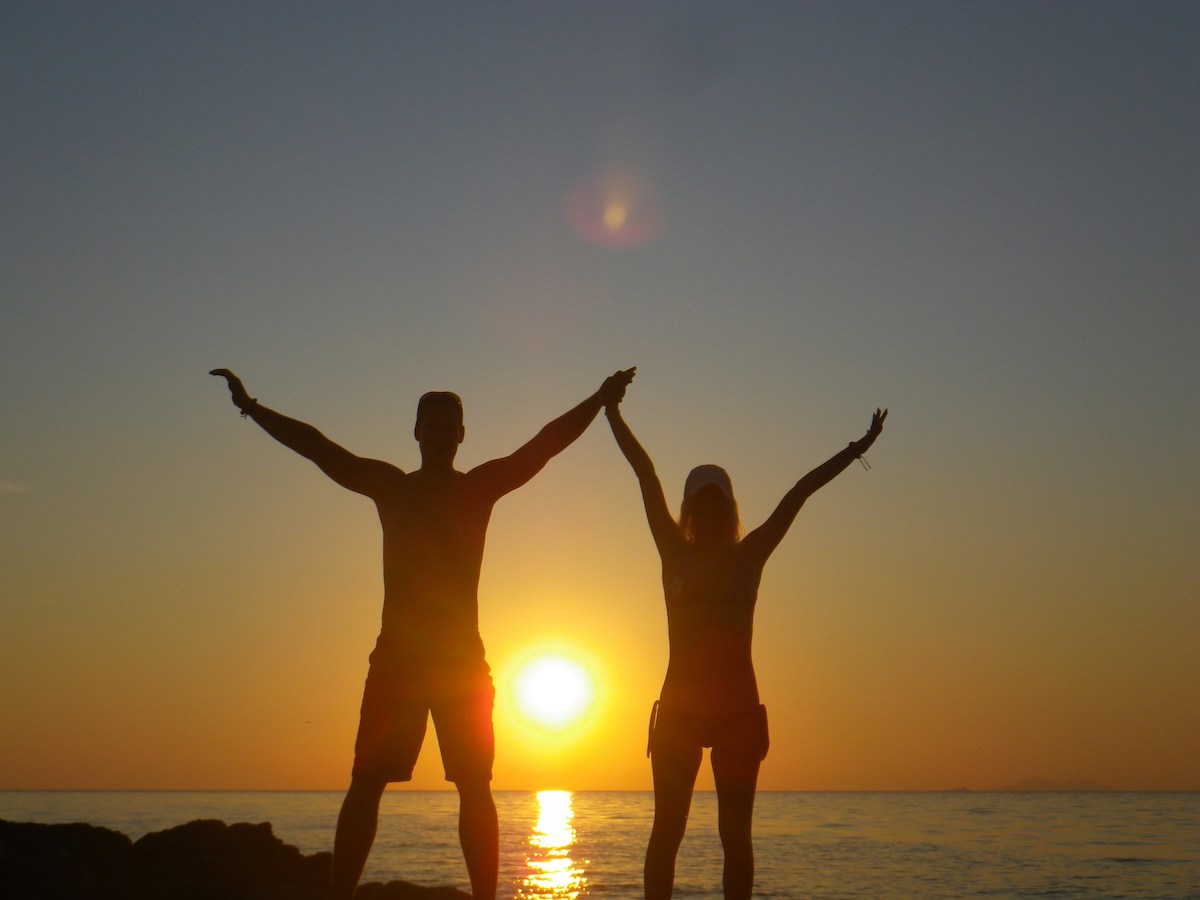 A couple in front of the sunset in Dubrovnik, Croatia