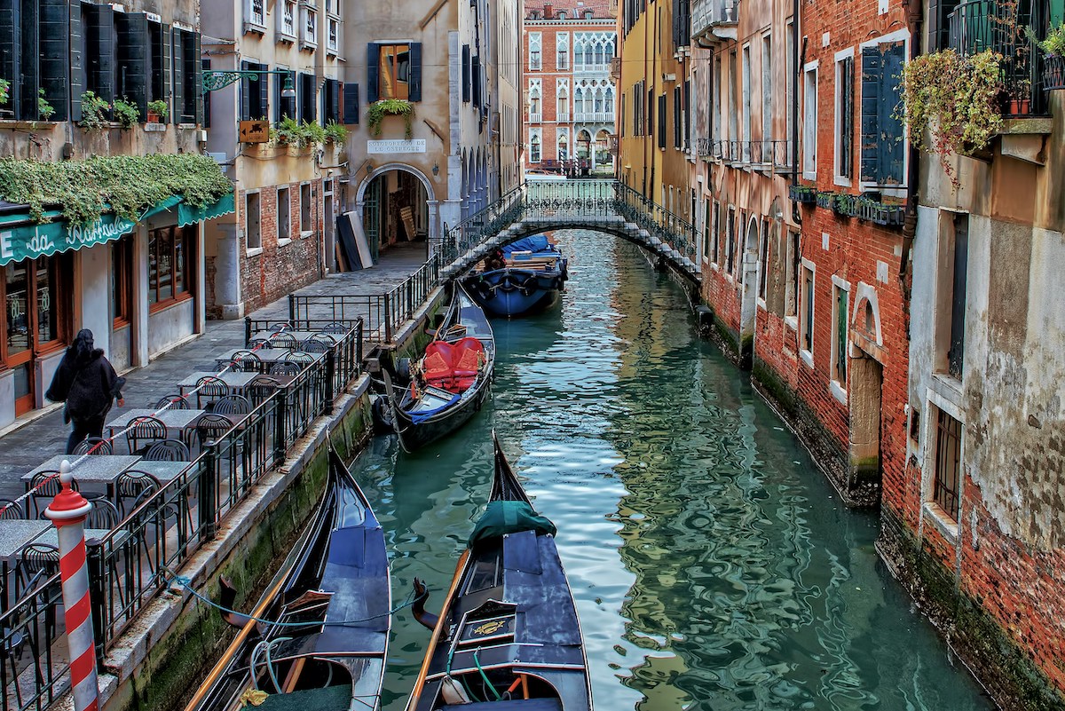 Venice canals with gondolas are idyllic of a romantic city break